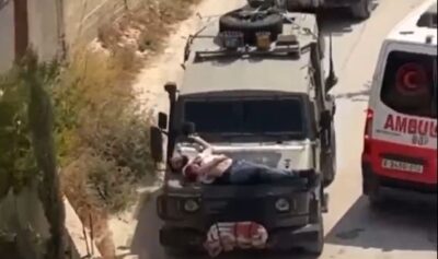 Soldaţi israelieni au legat un palestinian rănit de capota unui vehicul militar