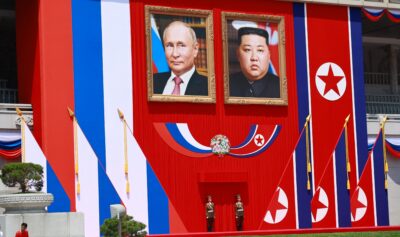 Portretele lui Vladimir Putin și Kim Jong-Un